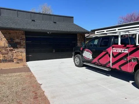 Affordable Door Co service truck at residential garage door job site in Oklahoma City