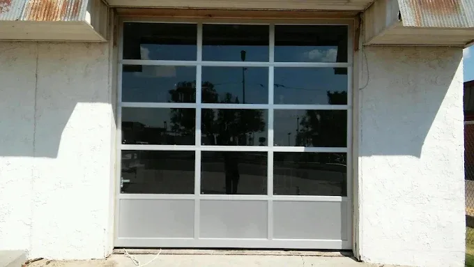 Commercial full-view glass garage door installed by Affordable Door Co in Oklahoma City OK