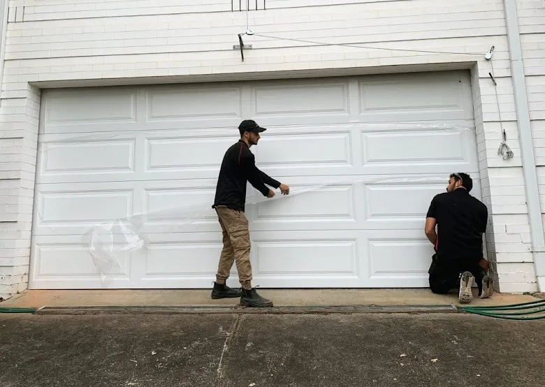 Affordable Door Co technicians installing new garage door in Oklahoma City OK
